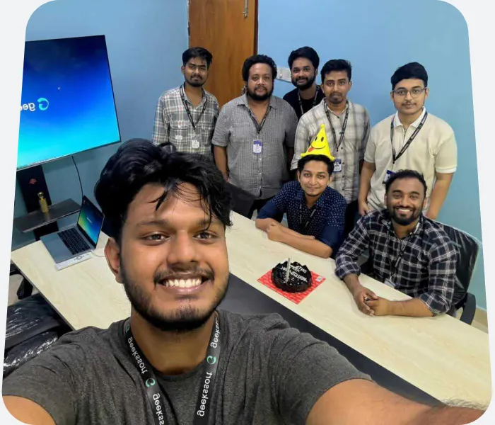 The team around a table at an office celebration