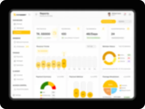 The FitSSort reports screen, showing revenue trends beside a member-status donut and payment summaries.