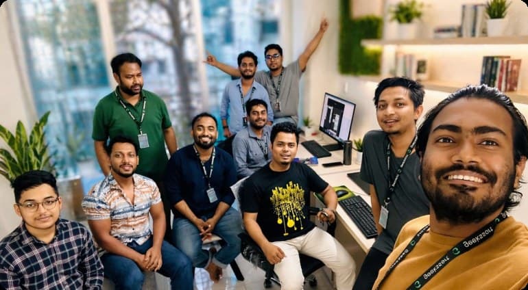 The GeeksSort team together at their desks in the Dhaka studio.
